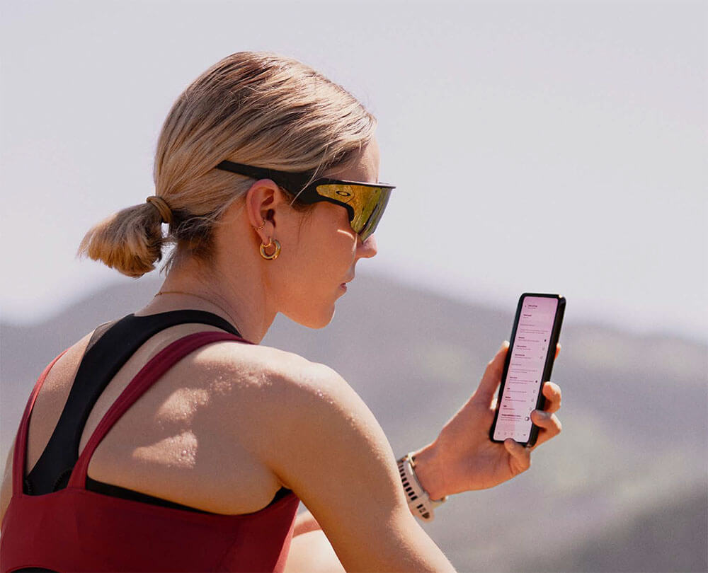 athlete female with phone vanguard oakley meta kodak lens vision centres eyetrust eyecare athlete female with phone vanguard oakley meta kodak lens vision centres eyetrust eyecare